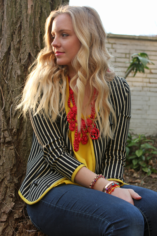 Striped blazer and bold necklace