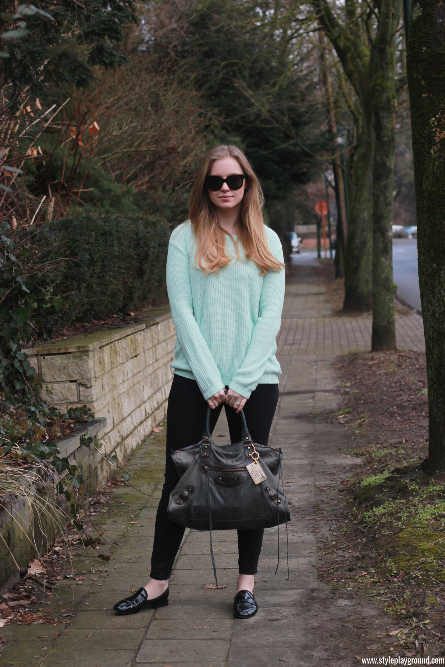 Axelle Blanpain of Style playground is wearing a Forever21 sweater, American Eagle jeggings, Repetto loafers, Balenciaga bag & Stella McCartney sunglasses