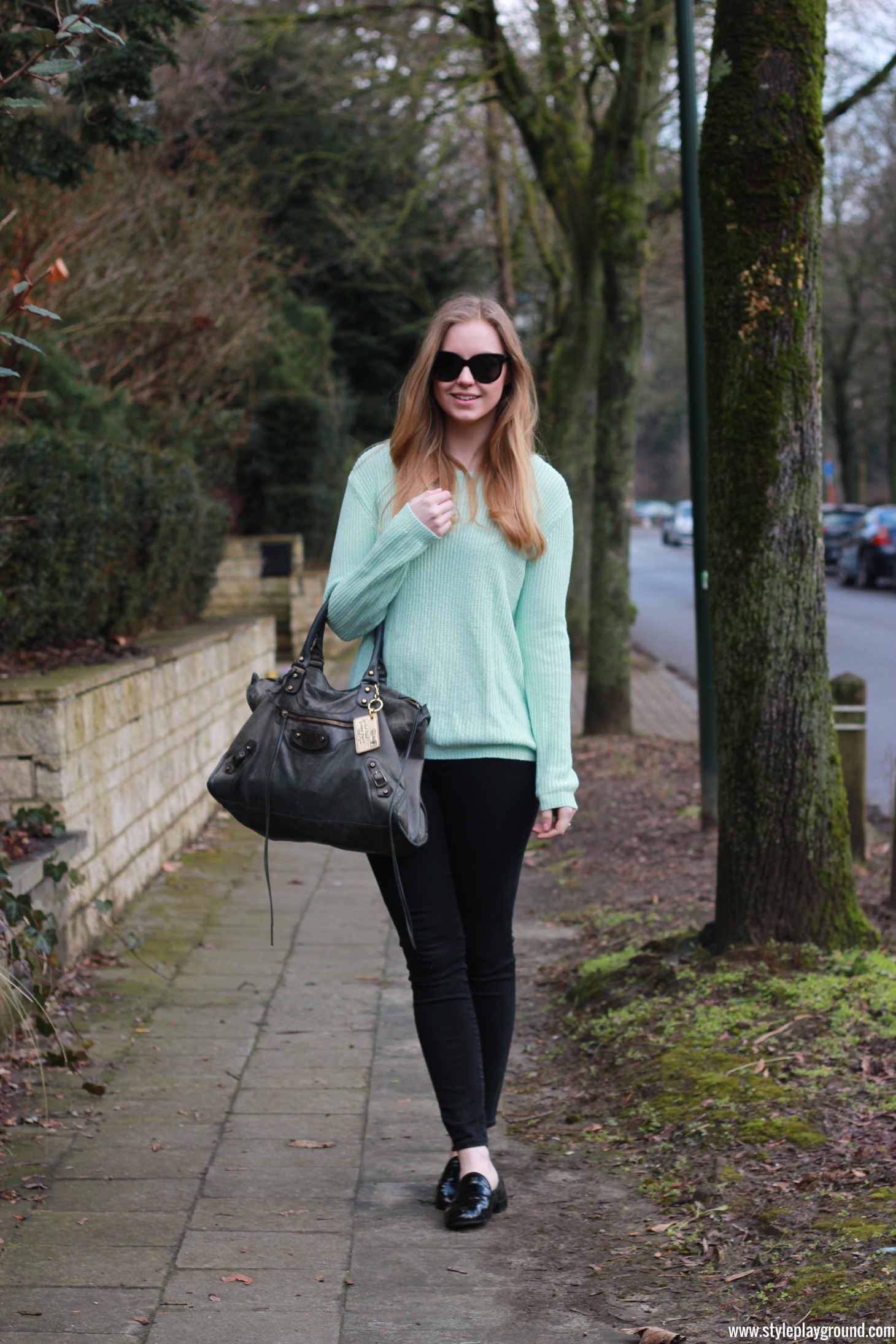 Axelle Blanpain of Style playground is wearing a Forever21 sweater, American Eagle jeggings, Repetto loafers, Balenciaga bag & Stella McCartney sunglasses
