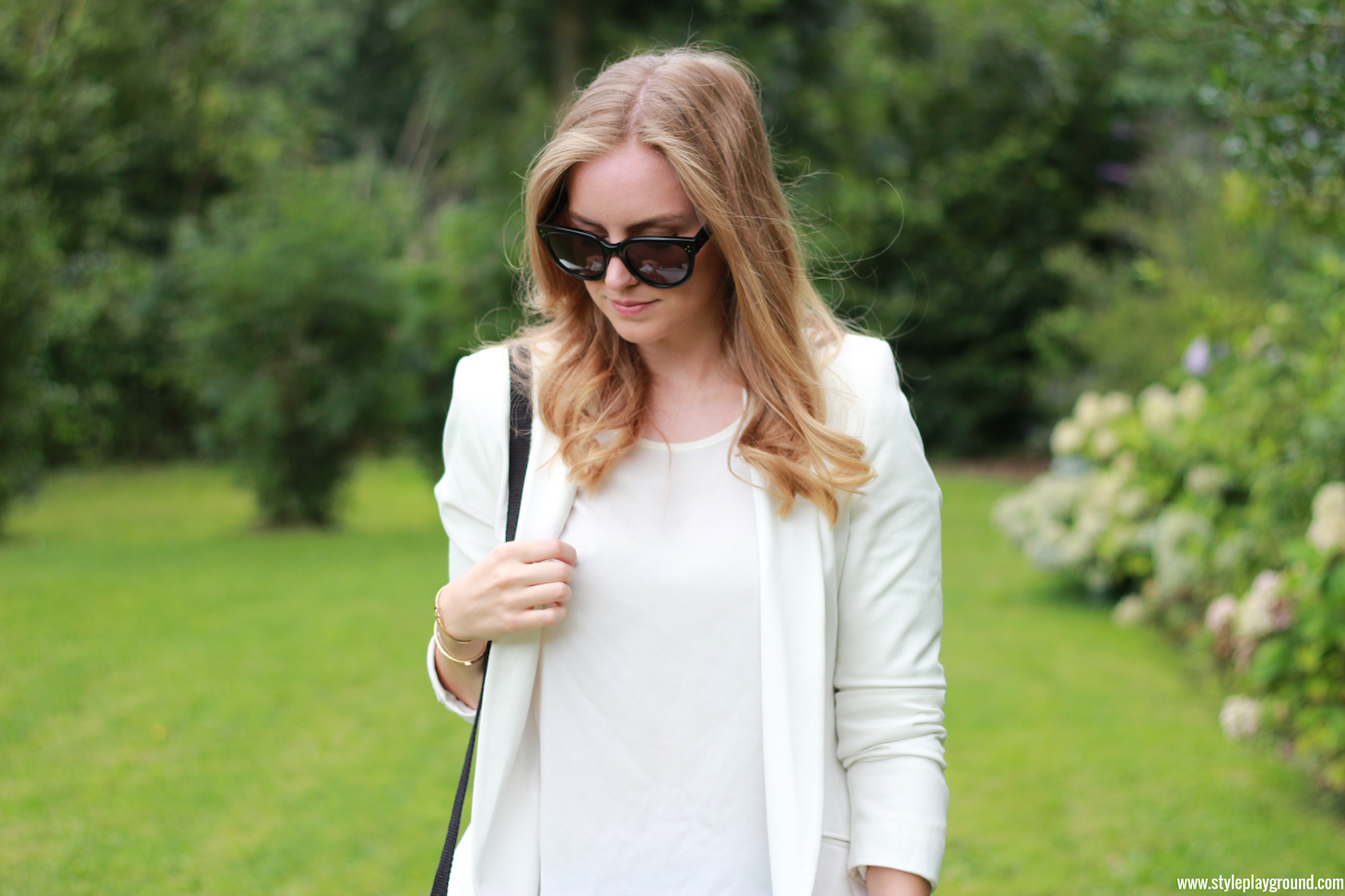 Axelle Blanpain of Style playground is wearing an Asos blazer, Mango top, American Eagle jeggings, white Converse, Celine Audrey sunglasses, S Oliver bag, Tiffany & Co T bracelet & Cartier love bracelet