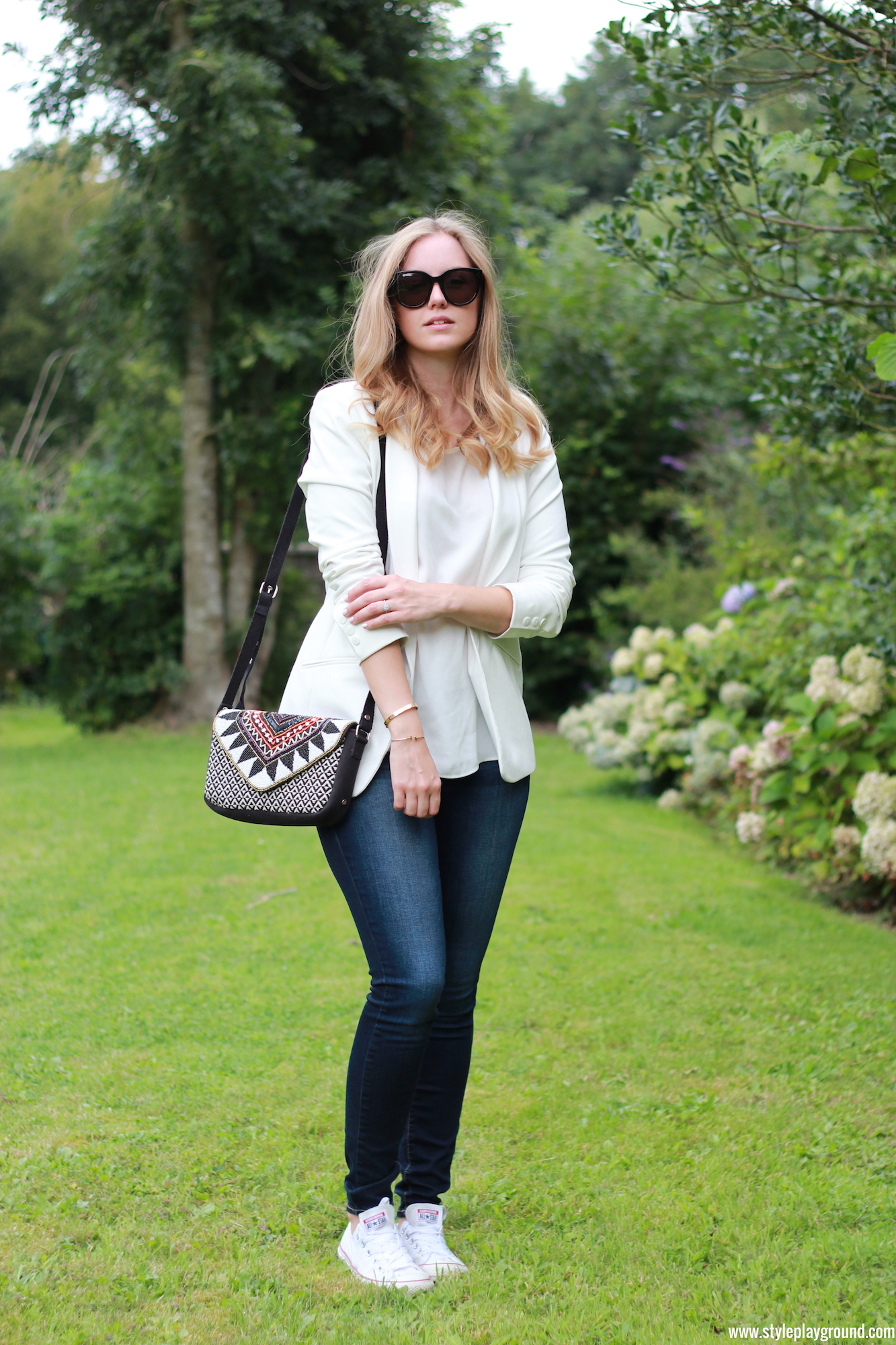 Axelle Blanpain of Style playground is wearing an Asos blazer, Mango top, American Eagle jeggings, white Converse, Celine Audrey sunglasses, S Oliver bag, Tiffany & Co T bracelet & Cartier love bracelet